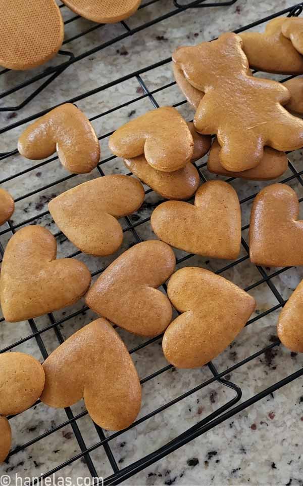 Heart shaped cookies on a cooling rack.
