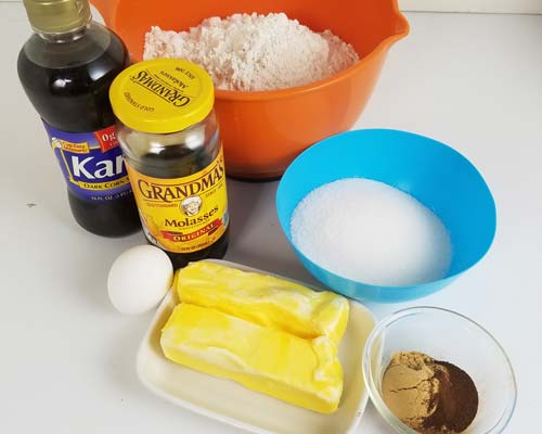 Gingerbread cookie dough ingredients on a counter.