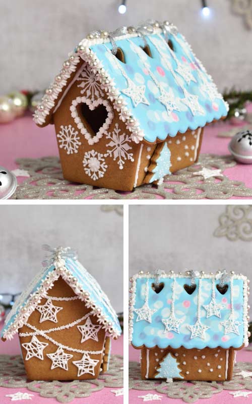 Decorated gingerbread house displayed on a table.