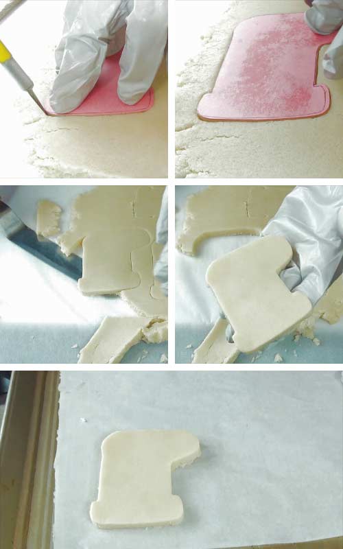 Hand cutting cookie using a template and exacto knife.