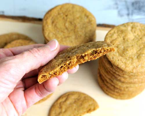 Holding a cookie in hand showing inside of the cookie.