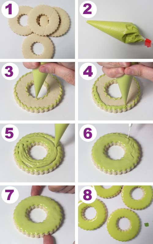 Outlining and flooding a wreath shaped cookie with royal icing.