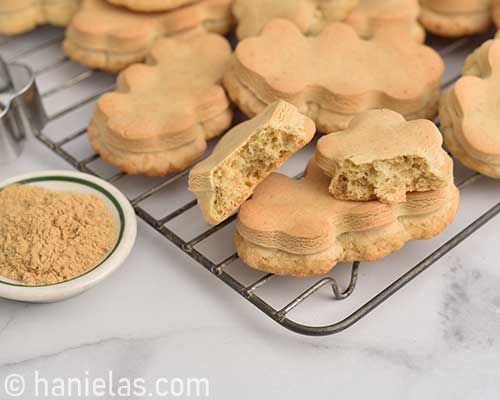 Cut baked cookie on cooling rack showing texture inside of a cookie.