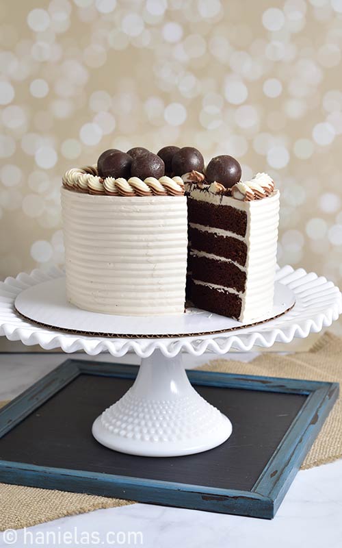 Buttercream cake on a cake stand.