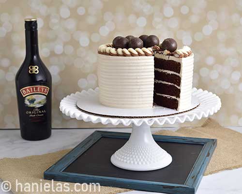 Cut cake on a cake stand.