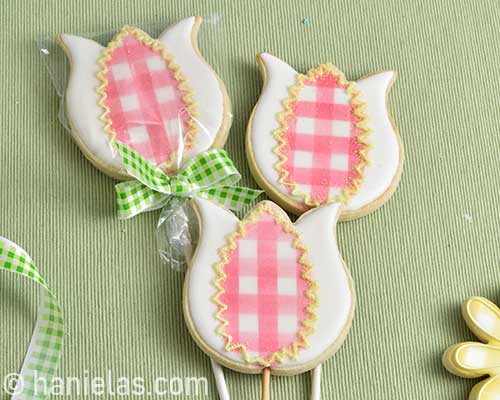 Cookie decorated with royal icing, packaged in a clear poly bag.