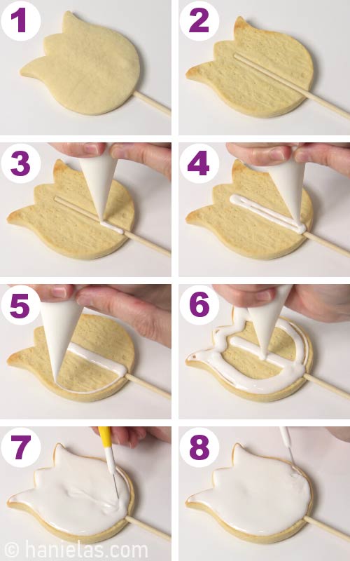 Outlining and flooding cookies on a stick with royal icing.