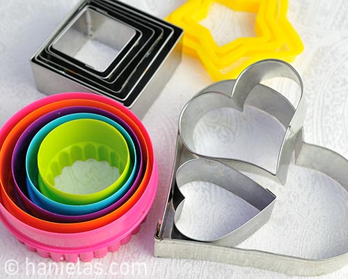 Plastic and metal cookie cutters.