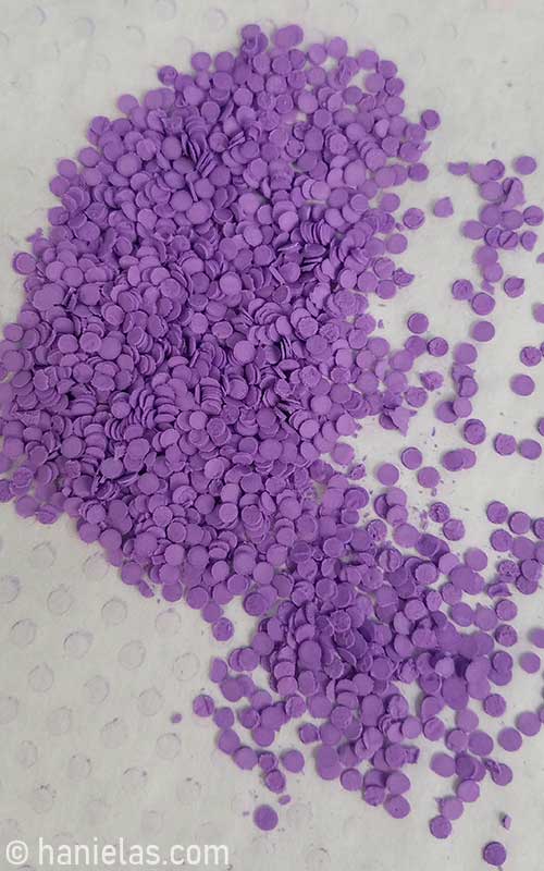 Small dry purple royal icing rounds.