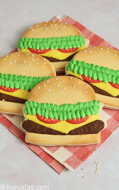 Cookies that look like hamburgers decorated with royal icing.