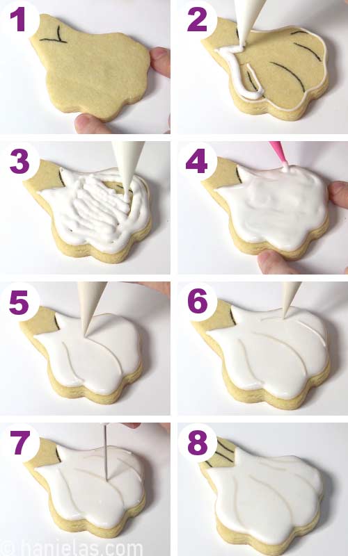 Flooding a garlic shaped cookie with white icing and piping darker lines onto the white.