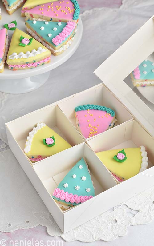 Decorated cookies in a bakery box.