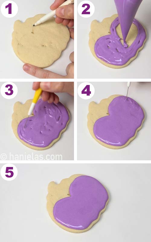 Outlining and flooding purple face of bride of Frankenstein cookie.
