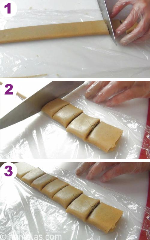 Slicing fig newtons with a knife.