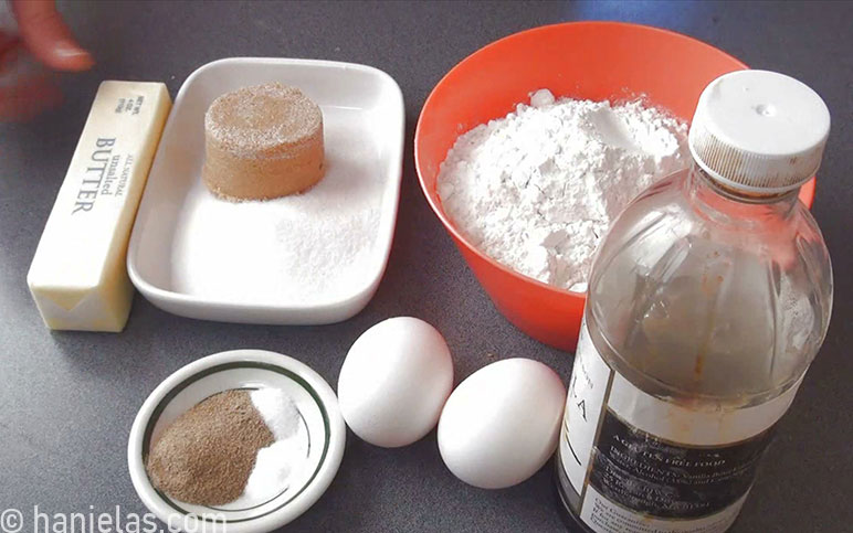 Ingredients for cookie dough in small bowls.