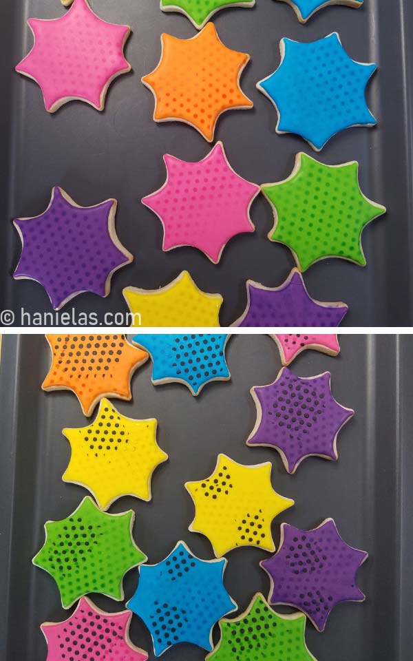 Cookies in a shape of a cob web decorated with royal icing laid flat on a gray tray.