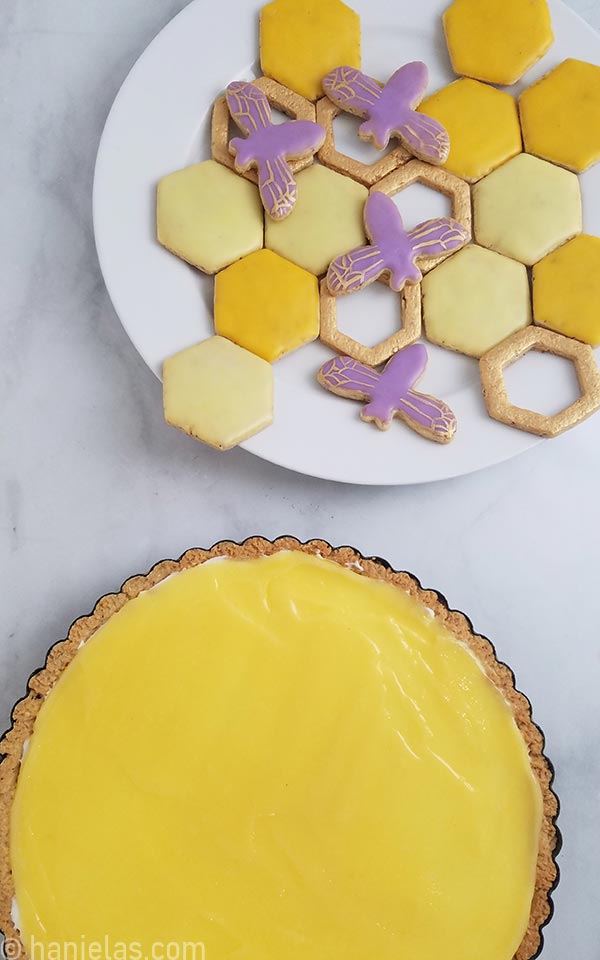 Plate with yellow, gold and purple decorated cookies.