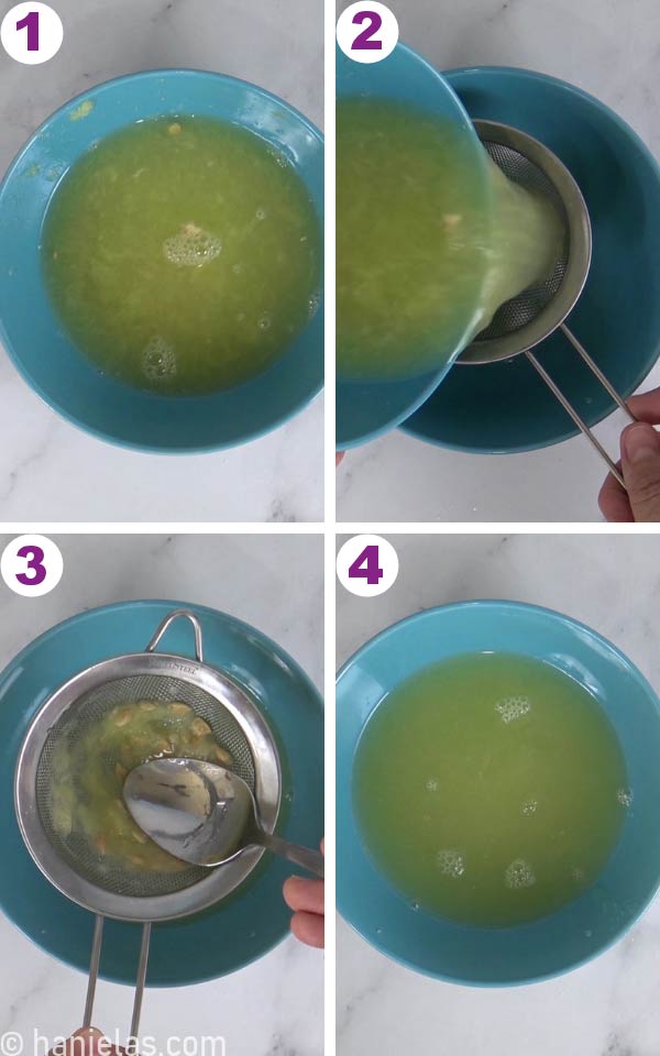 Straining freshly squeezed lemon juice into a blue bowl.