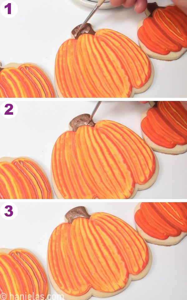 Painting a stem on a pumpkin with luster dust paint.