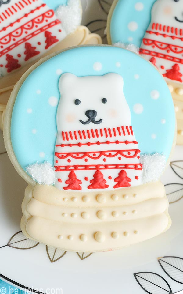 Snow globe cookies decorated with royal icing.