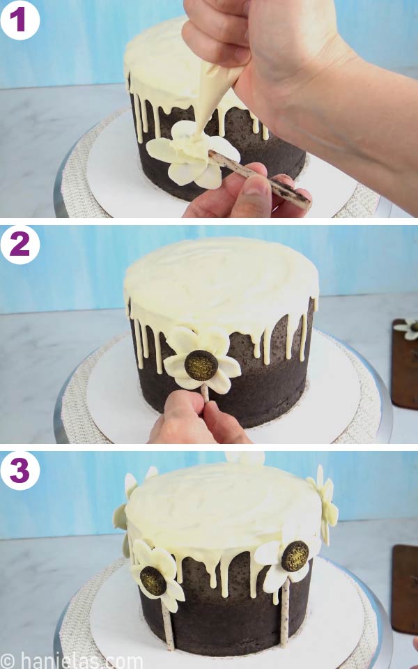 Gluing chocolate flowers onto the cake.