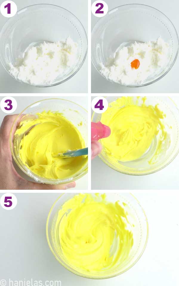 Yellow royal icing in a small glass bowl.