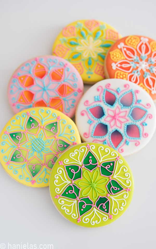 Decorated Mandala Cookies on white background.