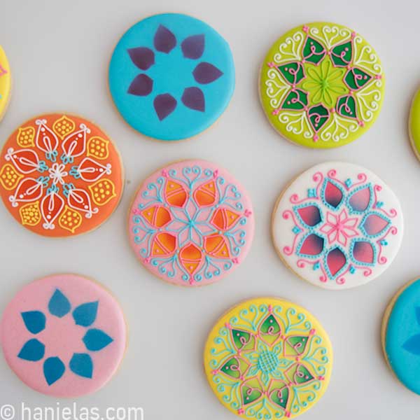 Cookies decorated with royal icing on a white background.