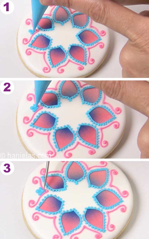 Piping 3 teardrops with royal icing.