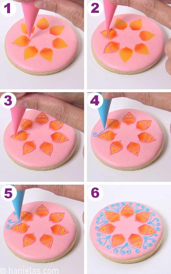 Outlining airbrushed shapes with pink royal icing.