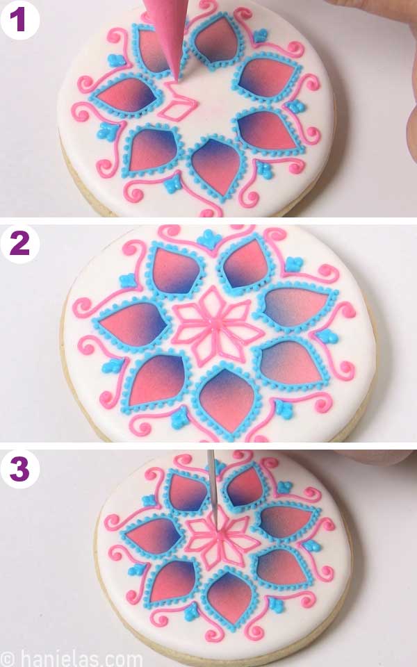 Piping kite outlines onto the white cookie.