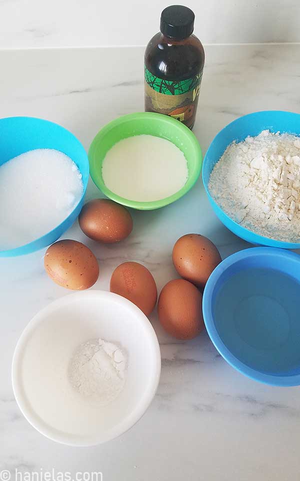 Small bowls with ingredients for a cake.