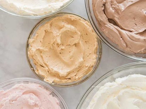 Five glass bowls filled with flavored buttercream.