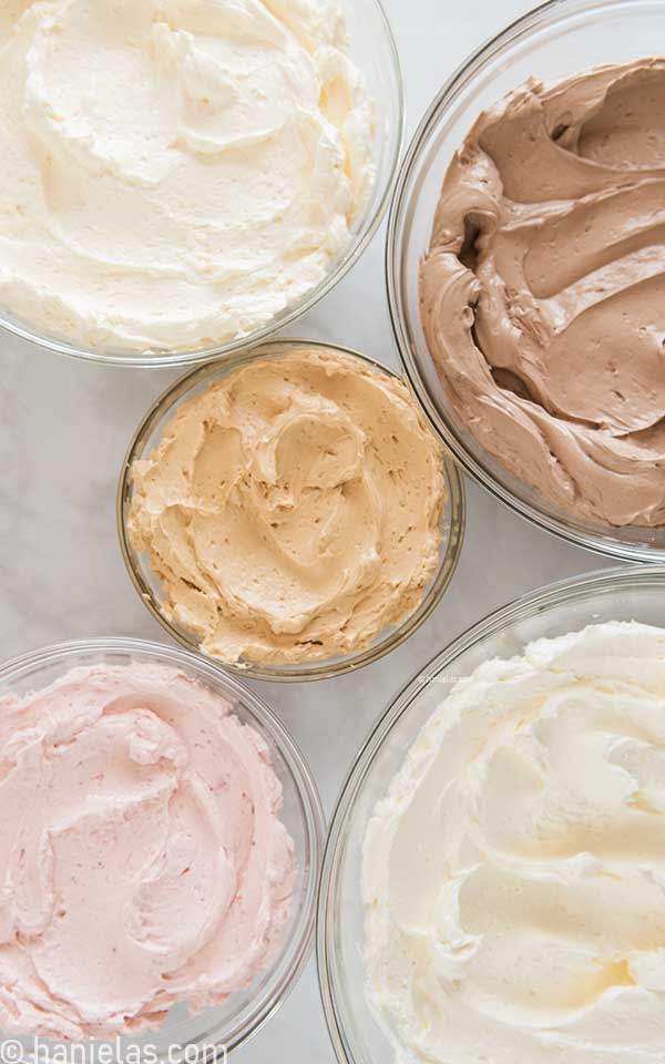 Five glass bowls filled with flavored buttercream.