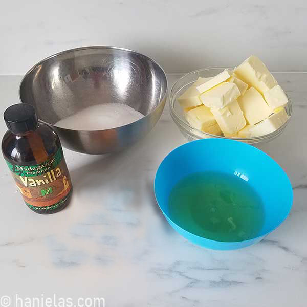 Bowl with sugar, butter, egg whites and vanilla extract.