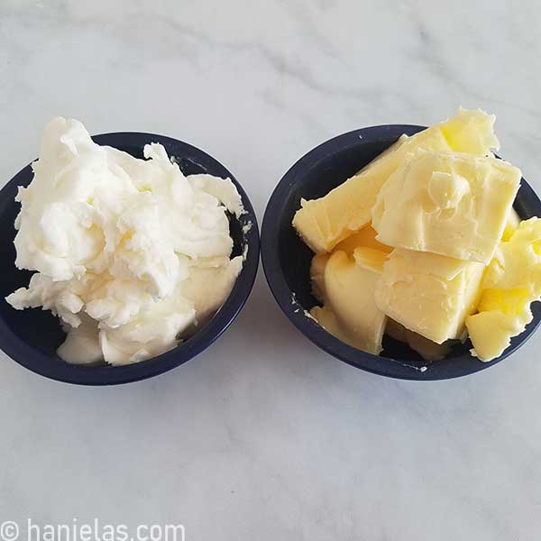 Small bowls next to each other filled with crisco and butter.