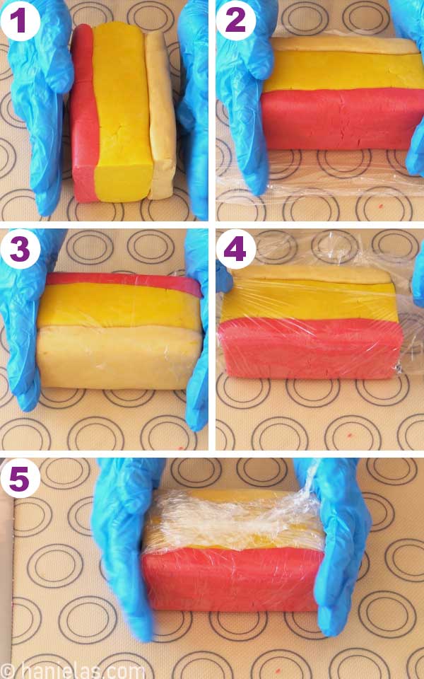 Wrapping a block of colored, chilled cookie dough into a food wrap.