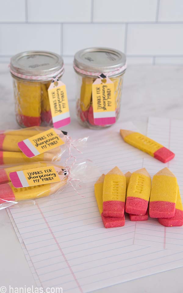 Baked pencil cookies packaged in small mason jars, and poly bags with a cute tag.