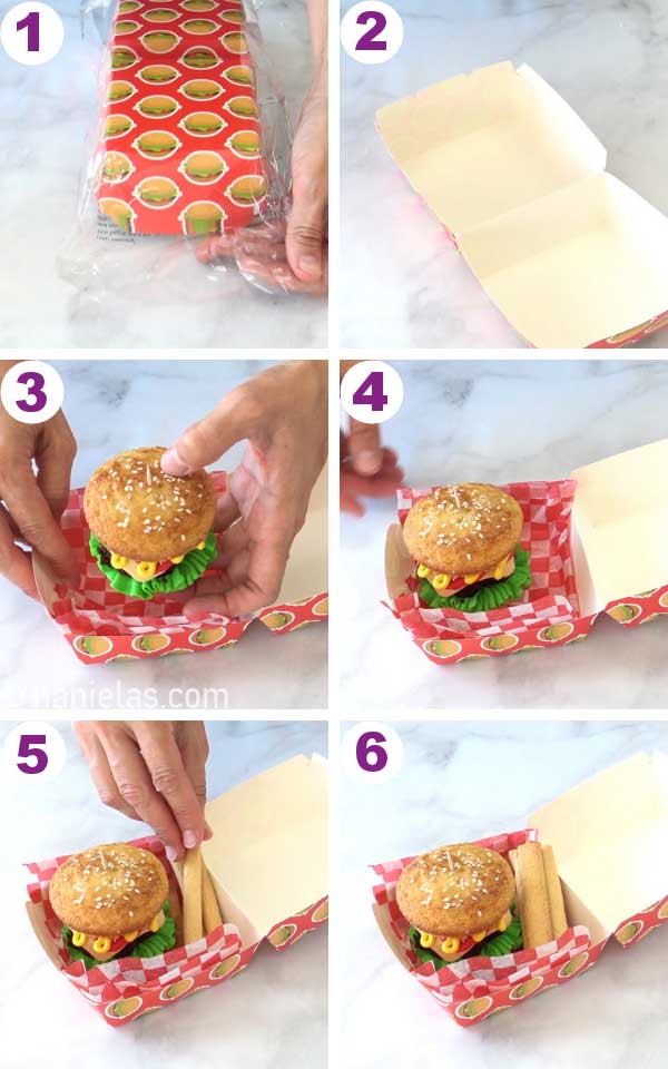 Hand placing decorated cupcake into a small paper box lined with red and white checkerboard paper.