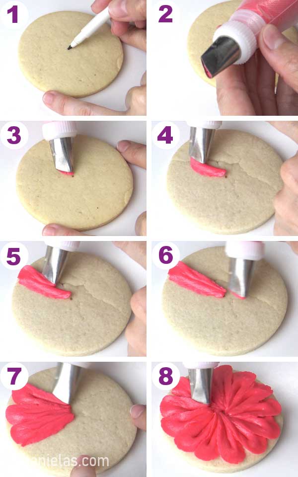 Piping petals with pink buttercream and petal piping tip.