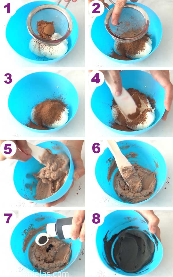 Sifting cocoa powder into white buttercream.