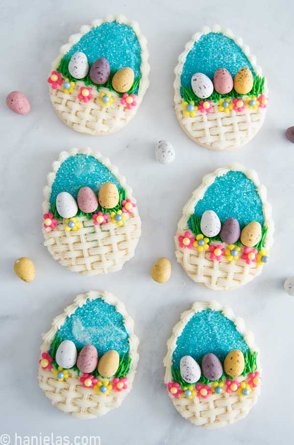 Bird's view of buttercream decorated Easter egg basket cookies.