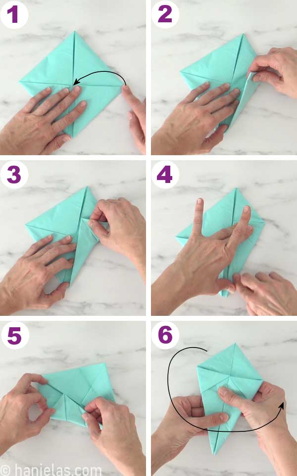 Folding a blue napkin.