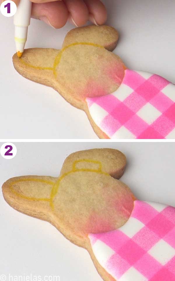 Drawing an ear with edible marker.