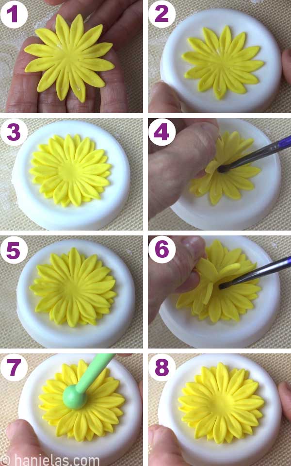Gluing three yellow fondant flowers in a shaper.