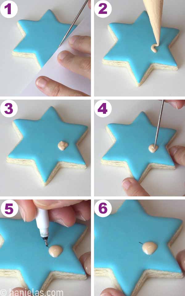 Piping a small candlestick onto a cookie.