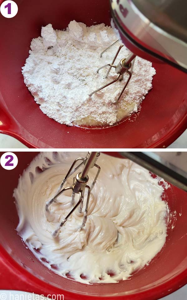 Burgundy red mixing bowl with the icing being mixed with two metal beaters.