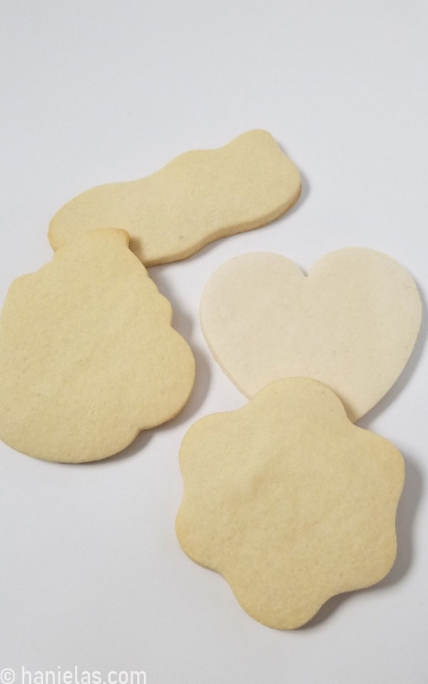 Undecorated sugar cookies in different shapes.