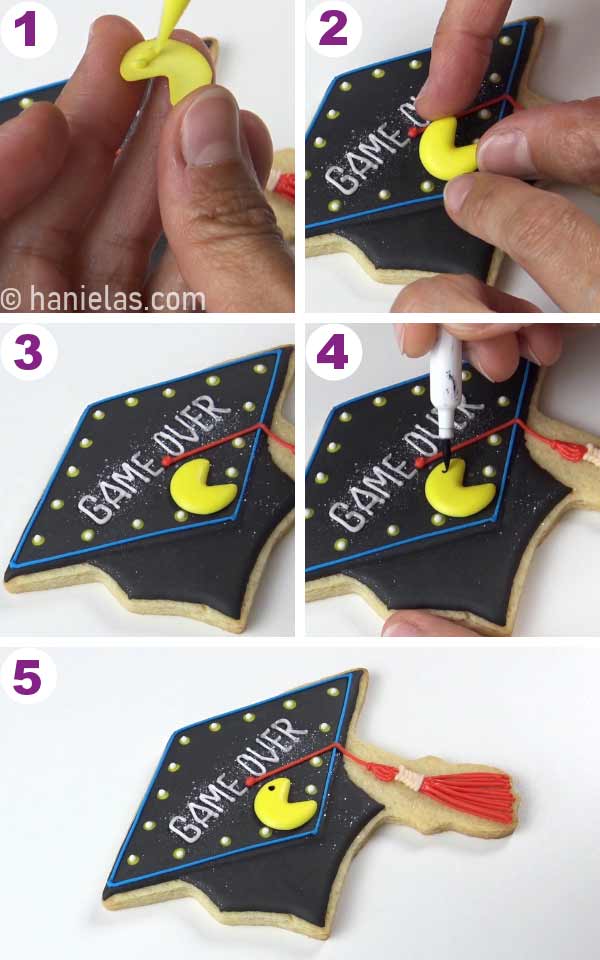 Gluing yellow royal icing transfer onto a cookie.