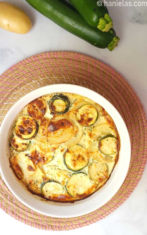 Round baking dish with baked casserole.